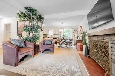 a living room with two chairs and a fireplace at Unique Oasis with Tri-City Access in Mississauga