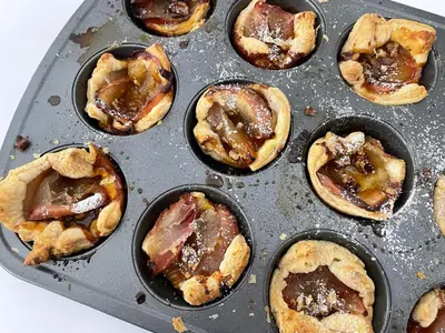 a metal muffin pan filled with pastries at Serenity Inn in Niagara Falls