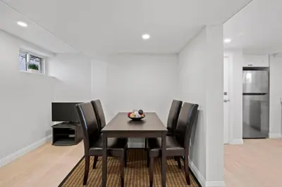 a dining room with a table and chairs at New 2 bedroom basement apartment in Guelph