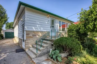 a house with a staircase in front of it at New 2 bedroom basement apartment in Guelph