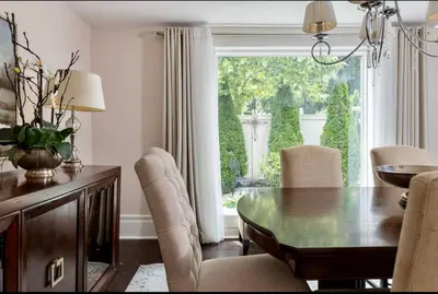 a dining room with a table and chairs and a window at Hummingbird Haven Bed & Breakfast Luxury Suite With Terrace & Seasonal Lake Views Located in Historic Old Town Niagara-On-The-Lake in Niagara on the Lake
