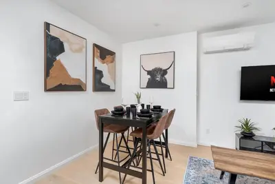 a dining room with a table and chairs at Hidden Gem - 3 BR Steps to Little Italy and UofT in Toronto