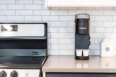 a coffee maker sitting on a counter in a kitchen at 1 Bed, 1 Bath Lovely Open Concept Resort Condo in Blue Mountains
