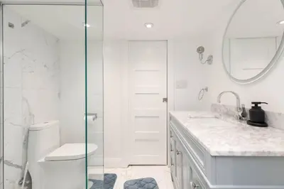 a bathroom with a shower and a toilet and a sink at Grand 3 BR Toronto Victorian Entire Home in Toronto