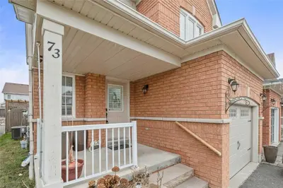 a brick house with a white door and a porch at Beautiful 3 bedroom Entire detached home in Whitby