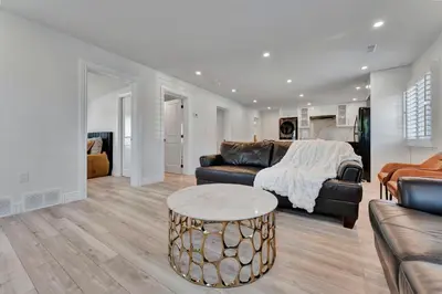 a living room with a couch and a table at Luxe Lodges Lake Erie in Port Dover