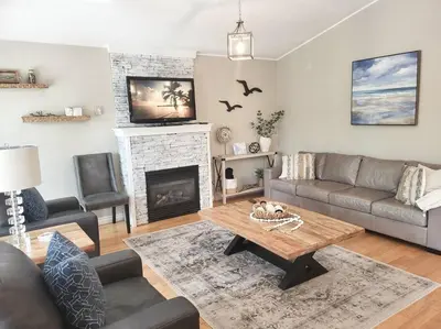 a living room with a couch and a coffee table at Nancy by the Bay Wasaga Beach in Wasaga Beach