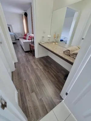 a room with a counter top and a mirror at Beautiful Family Suites - Master Bedroom in Niagara Falls