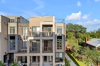 an exterior view of a apartment building at Designer Yorkdale 2BR Townhouse, Private Patio, Parking in Toronto