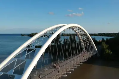 a white bridge over the water with people on it at Heritage 3BR Etobicoke Gem, Sherway Gardens, BBQ in Toronto