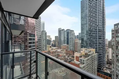 a view of a city from the balcony of a building at Modern 1BR Condo by Yorkville w Sofa Bed Sleeps 3 in Toronto