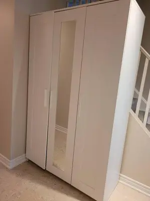 a pair of white cabinets in a room at Cozy and comfy Studio Apartment in Richmond Hill