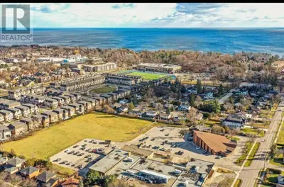 an aerial view of a city with the ocean at Rare 3 Bedroom Luxury Close to Lake in Oakville