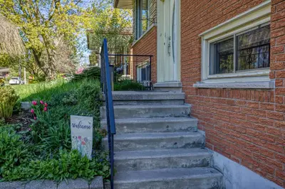 a set of stairs leading up to a house at Bright & Modern 1 bedroom unit! in Guelph