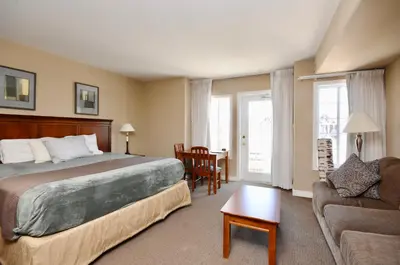 a hotel room with a bed and a couch at Relaxing 2BR Retreat at Carriage Hills in Edgar
