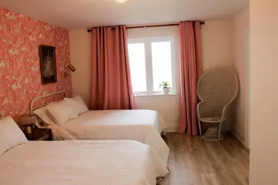 a hotel room with two beds and a window at Boutique Accommodation in PEC - Suite 4 in Belleville