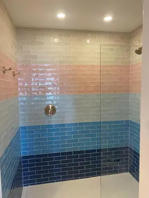 a bathroom with blue and pink tiles and a shower at Boutique Accommodation in PEC - Suite 4 in Belleville