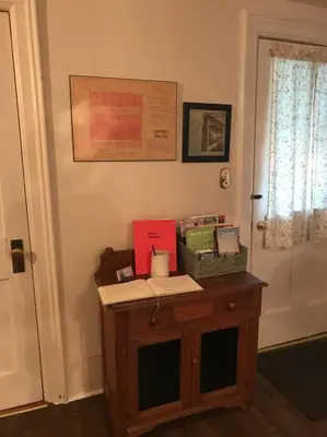a room with a table with boxes on it at Charming Farmhouse in the City, Near Wine Country in Belleville