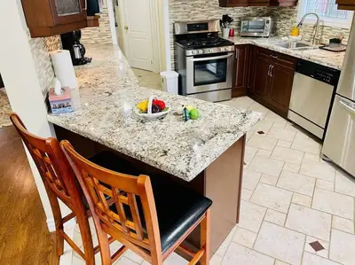 a kitchen with a island with a bowl of toys on it at Three bedroom house in Mississauga