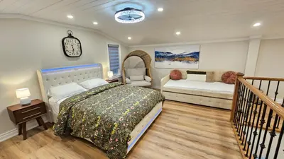 a bedroom with a bed and a couch at Luxury Family House 3 beds, 1 bath, 5 guest in Toronto