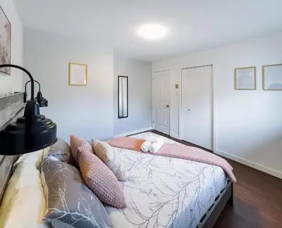 a bedroom with a bed with pillows on it at Pet-Friendly Large 3-Bedroom - Bobcaygeon in Bobcaygeon