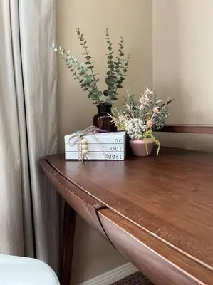 a table with a vase and flowers on it at 45 per Off Monthly Stay - 7 Beds - BBQ in Kitchener