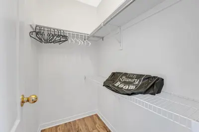 a bag sitting on a shelf in a room at Elegant 3Bedroom with Smart TV and Backyard in Mississauga