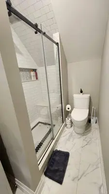 a bathroom with a shower and a toilet at ENTIRE BACHELOR UNIT EN-SUITE ACROSS FROM GOOGLE - br4 in Kitchener