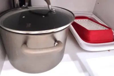 a pot sitting on a counter next to a red container at Basement Waterloo Near 24-7 Restraints in Waterloo