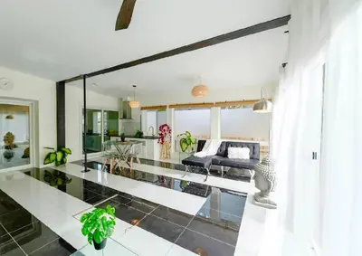a living room with a couch and a table at River Runs Through It in Belleville