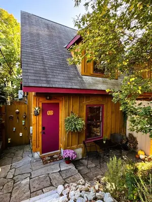 a house with a purple door and a patio at The Cozy Corner in Elora