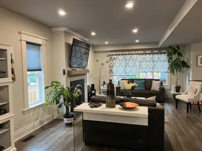 a living room with a couch and a table at Luxury and comfy Home- Niagara getaway in Niagara Falls