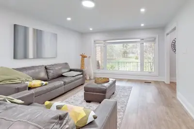 a living room with a couch and a table at Newly renovated luxury villa in Stouffville, ON in Stouffville