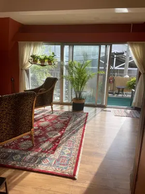 a living room with two chairs and a rug at Big apartment by the Farmers market in Kitchener