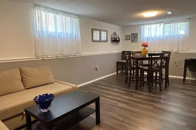 a living room with a couch and a table at 2 bedroom rental apartment , 1 sofa bed, 2 car parking in Mississauga