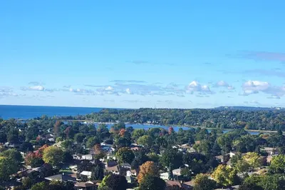 an aerial view of a town with trees and a lake at Lakeview Escape Endy KING BED in Pickering