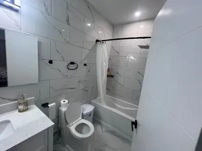 a bathroom with a toilet and a sink and a tub at Bb11 Private Bathroom Room In Cambridge in Cambridge