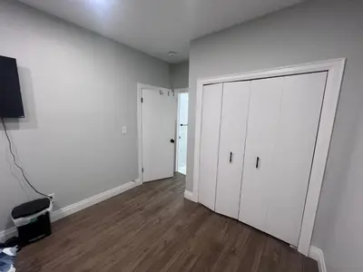 an empty room with white cabinets and a door at Bb11 Private Bathroom Room In Cambridge in Cambridge
