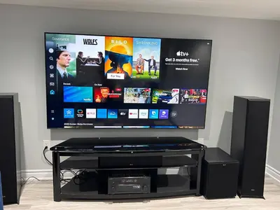 a flat screen tv sitting on top of a entertainment center at Ravine Retreat - 3RM Suite, 2BD, 1 WR, Pool, Sauna in Whitby