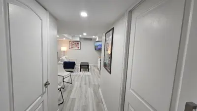 a hallway with a door leading to a living room at Garden Ave Home 1mins to HWY 403 in Brantford