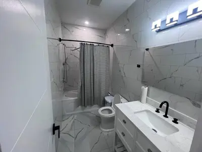 a white bathroom with a sink and a toilet at B12 Private Room In Cambridge in Cambridge