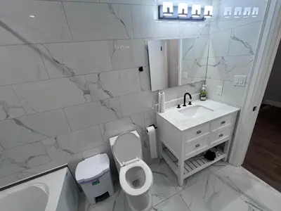a bathroom with a toilet and a sink and a mirror at Private Bathroom Room In Cambridge B7 in Cambridge