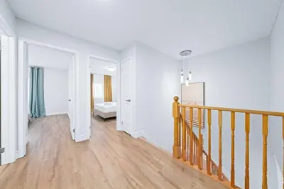 an empty room with a staircase in a house at Stylish and Cozy 4 bedroom House in Barrie