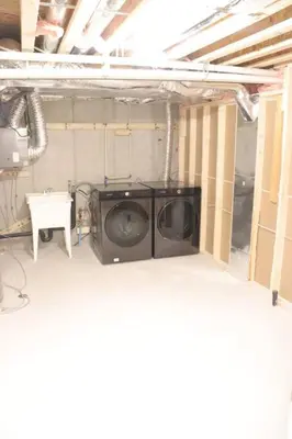 a laundry room with a washing machine in it at Brand New Luxurious 4B Townhouse in Oshawa