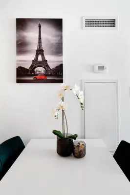 a white table with a picture of the eiffel tower at Upscale 1 Bed & Den Downtown Toronto in Toronto