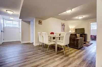 a living room with a table and chairs and a couch at GLOBALSTAY New Basement 4 Bd in Port Elgin in Port Elgin