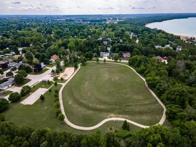 an aerial view of a large green field with a lake at GLOBALSTAY New Basement 4 Bd in Port Elgin in Port Elgin