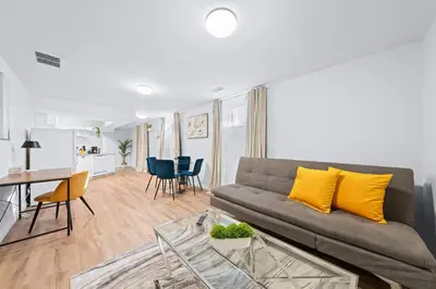a living room with a couch and a table at Charming 1-bed basement, Wi-Fi in Barrie