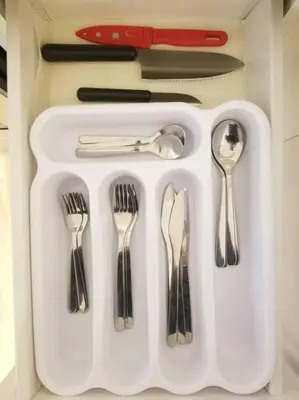 a white tray with silver utensils in a drawer at Modern & Cozy 1 Bedroom with fast Wi-Fi, BBQ & Patio in Barrie