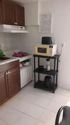 a kitchen with a counter with a microwave on a table at Multiple Fair Price Great Amenities Rooms in Richmond Hill